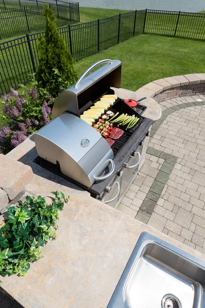 Healthy outdoor living cooking in a summer kitchen — Stock Photo, Image