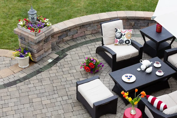 Brick paved patio with patio furniture — Stock Photo, Image