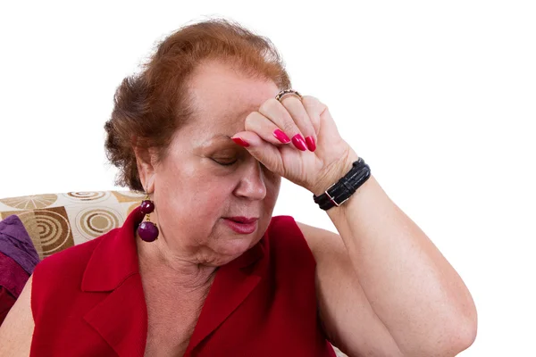 Señora mayor que sufre de un dolor de cabeza —  Fotos de Stock