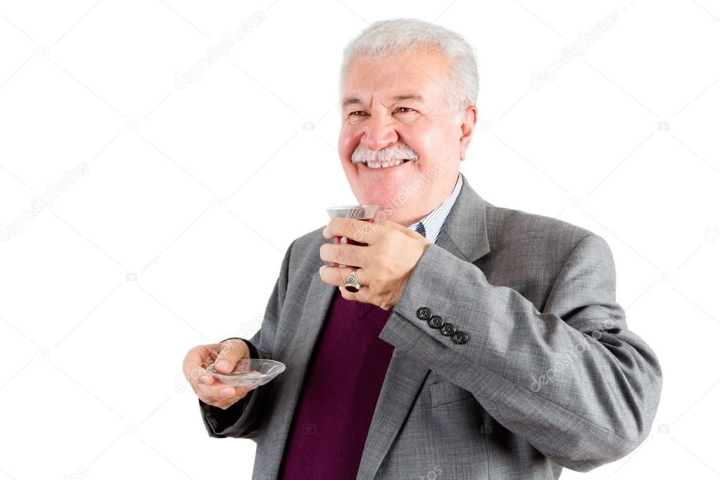 Smiling Senior Businessman with Tea Looking Out