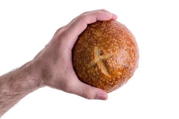 Saubere Männerhand greift nach einem Sauerteigbrötchen — Stockfoto