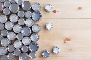 Conceptual background of multiple canned foods for food drive donations clipart