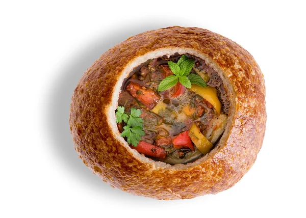 Wholesome vegetable soup in a sourdough bread bowl — Stock Photo, Image