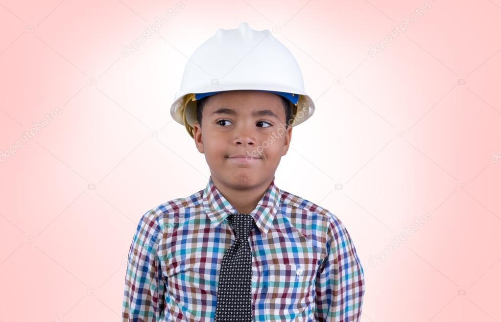 Male child in hard hat looking over