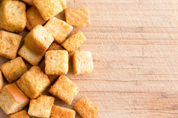 Crispy golden freshly sauteed croutons — Stock Photo, Image