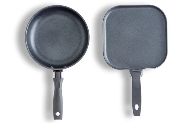 Round and square clean pans or skillets — Stock Photo, Image