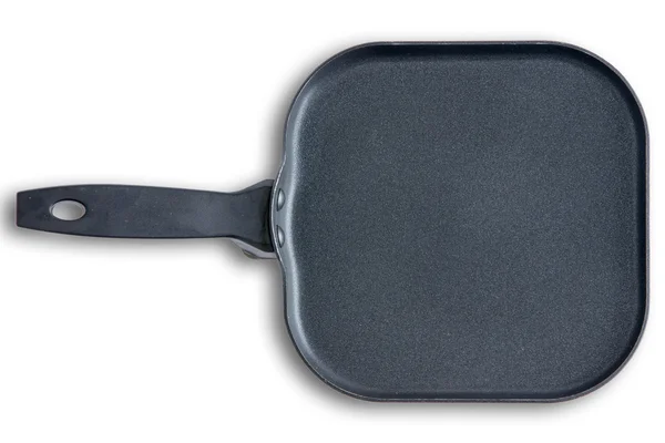Квадратная кухонная сковорода с фасонными уголками — стоковое фото