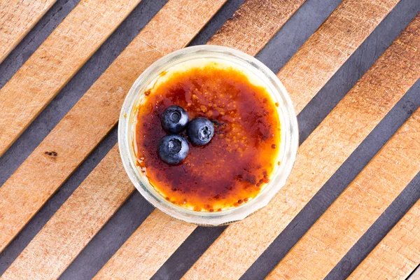 Above view of delicious custard and blueberries — Stock Photo, Image