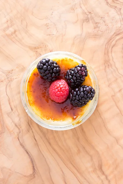 Delicious custard bowl with raspberries — Stock Photo, Image