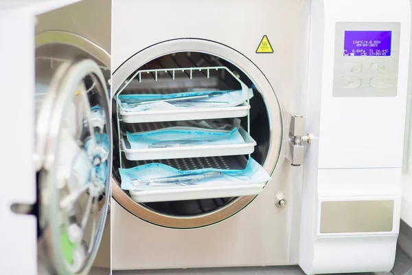 Treatment of manicure tools in the oven. Sterilization and disinfection of instruments in a dry heat cabinet. Autoclave