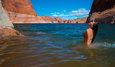 Bikini Woman taking a relaxing bath in the Lake Powell