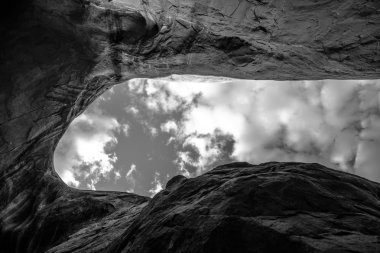 Cave Point Escalante Looking up at the sky from the inside 