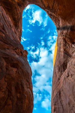 Cave Point Escalante Looking up at the sky from the inside 