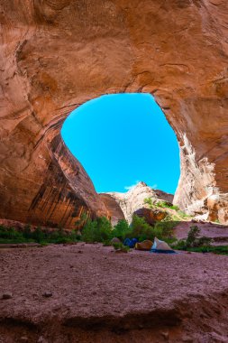 Camping in Coyote Gulch clipart