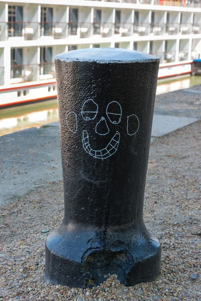 Capstan with cartoon smiling face. — Stock Photo, Image