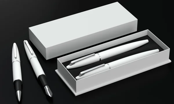 Writing set. Ball pen and ink pen in a box on a black background — Stock Photo, Image