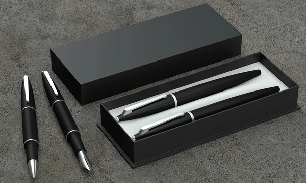 Conjunto de escrita. Caneta esferográfica e caneta de tinta em uma caixa em um backgro de concreto — Fotografia de Stock