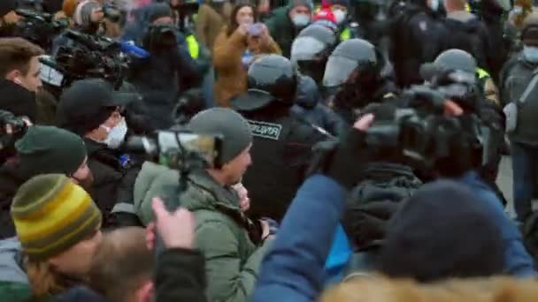 Police force detain protester rebel man. Policeman arrest people politic strikes — Stock Video