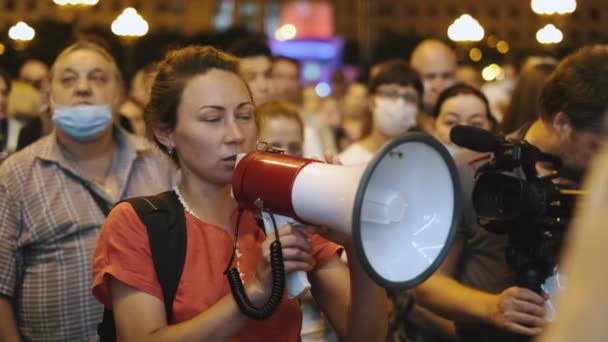Equality demanding feminist talking calmly with megaphone bullhorn on rally riot — Stock Video