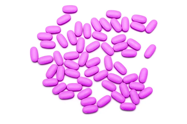 Pillole rosa sul bianco — Foto Stock