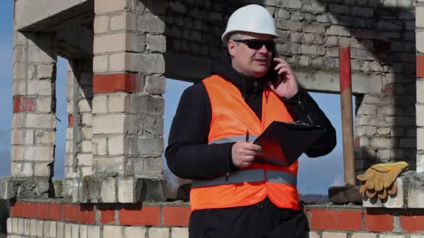 Civil engineer writes and talking on tablet PC — Stock Video