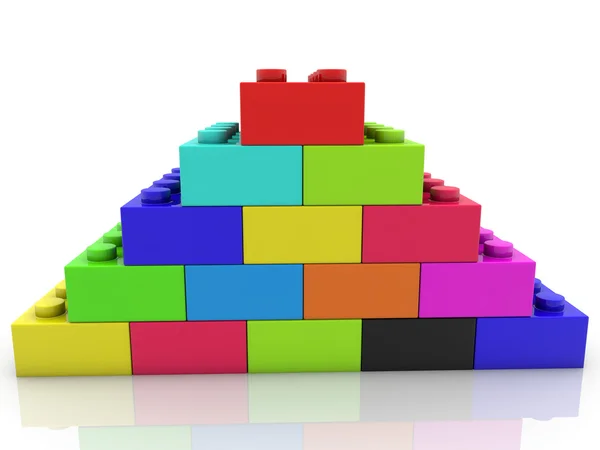 Pyramid of toy bricks in various colors — Stock Photo, Image
