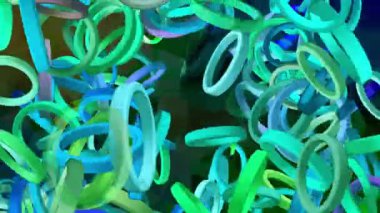 Rastgele dönen mavi, yeşil halkalar soyut