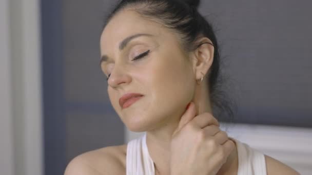 Woman Massaging Her Neck Suffering Pain — Stock Video