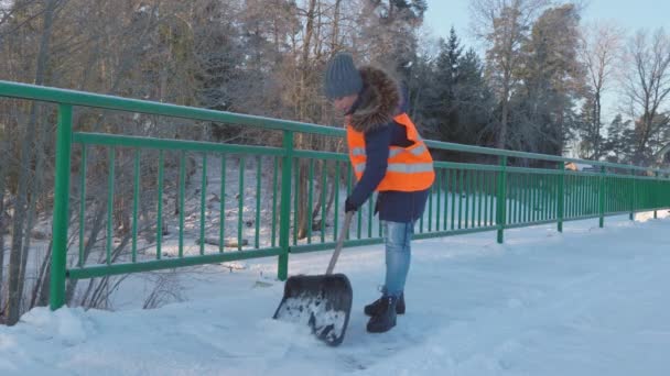 Woman Janitor Working Bridge Snow Shovel Cold Winter Day — Stock Video