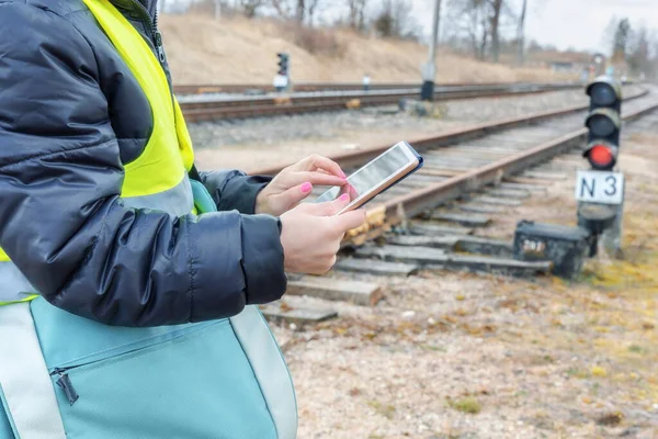 Railroad worker collects data on the tablet