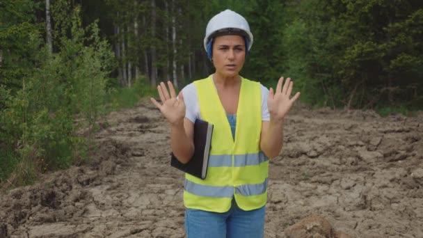 Woman Engineer Forest Road Showing Way Gesture — Stockvideo