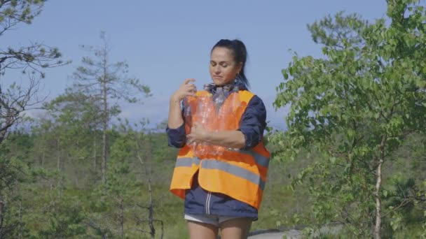 Woman Park Ranger Holding Plastic Bottles Path Forest — Stock Video