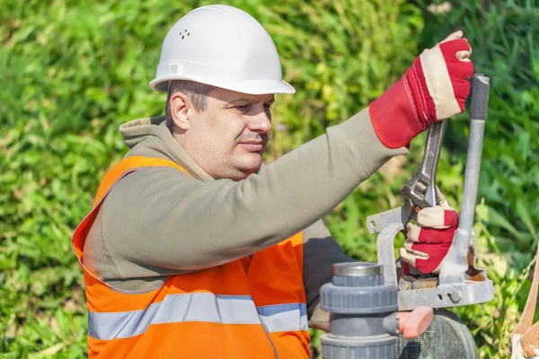 Worker with adjustable wrench — Stock Photo, Image