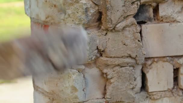 Man with sledge-hammer destroying wall — Stock Video