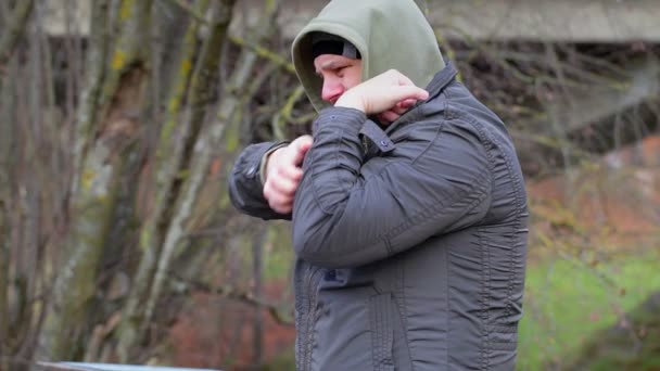 Man with itchy body at outdoors — Stock Video