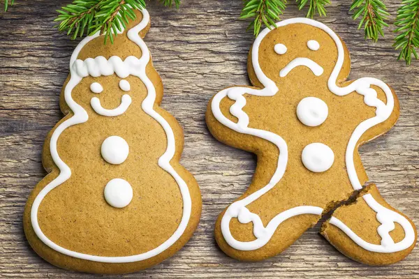 Christmas gingerbread shapes happy and unhappy — Stock Photo, Image