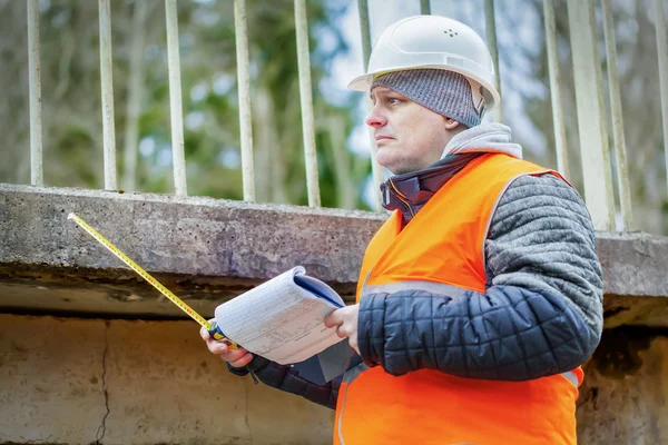 Engineer  under old bridge — Stock Photo, Image