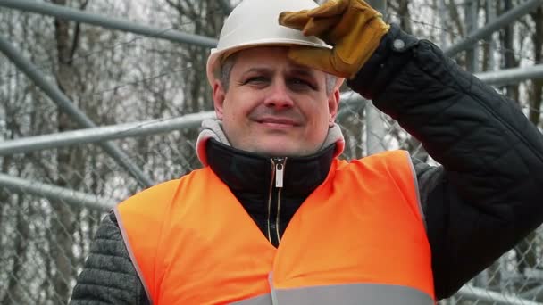 Happy worker with adjustable wrench at outdoors — Stock Video