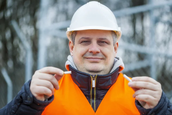 Worker with broken cigarette — Stock Photo, Image