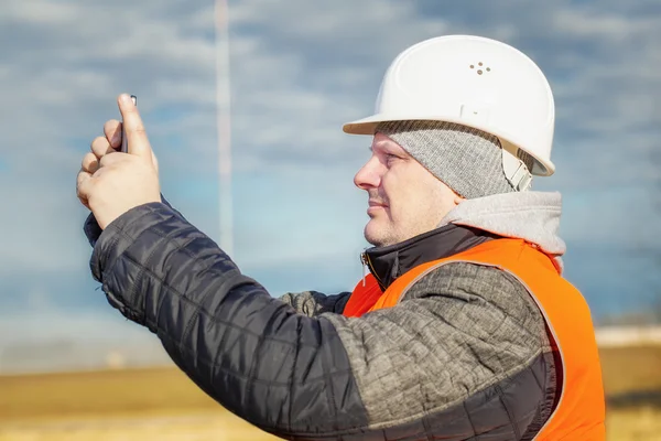 Engineer filmed with tablet PC at outdoors — Stock Photo, Image