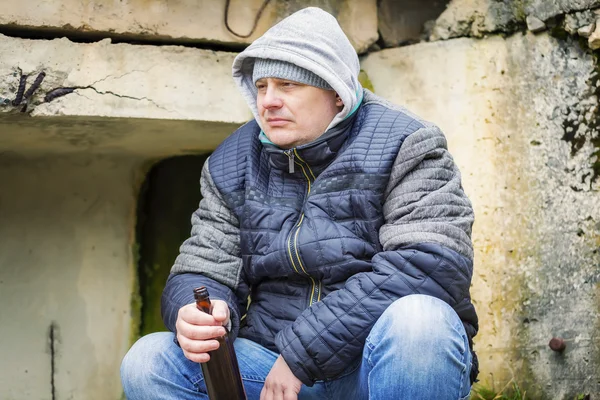 Man with beer bottle at outdoors — Stock Photo, Image