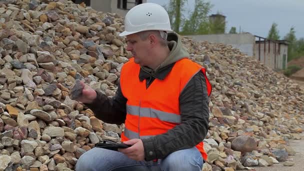 Construction inspector near the pile of crushed stone — Stock Video