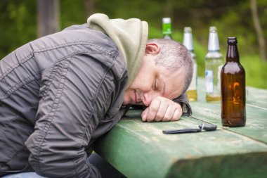 Drunk men sleeping on table