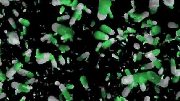 Abstracte pillen in het groen op zwart — Stockvideo