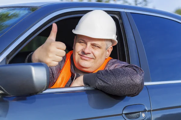 Worker in car showing thumb up — Stock Photo, Image