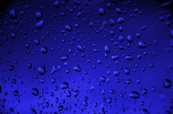 Fondo azul con agua de gota —  Fotos de Stock