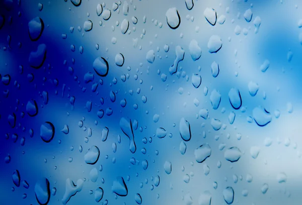 Fondo azul con agua de gota —  Fotos de Stock