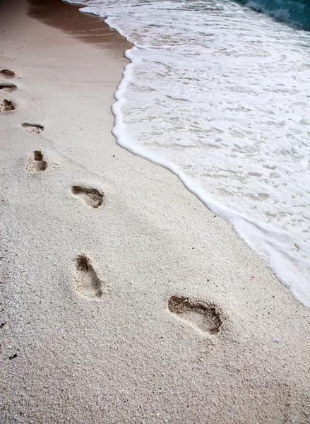 Footprints on beach — Stock Photo, Image