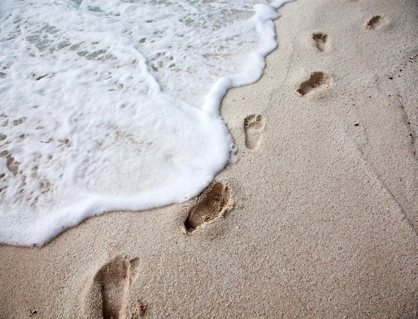 Footprints on beach — Stock Photo, Image