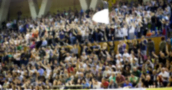 Blurred background of crowd of people in a basketball court — Stock Photo, Image